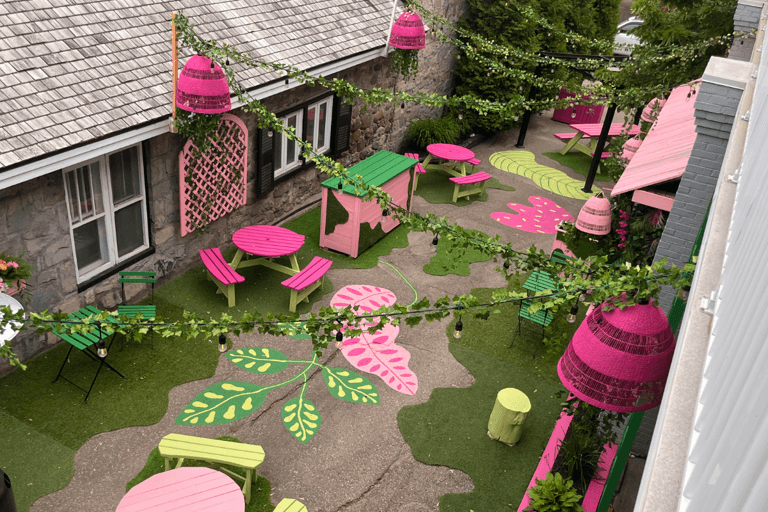 A pink and green outdoor patio.
