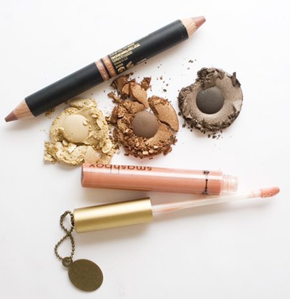 From top: Smashbox Double Take Lip Color ($25) in "Amaretto", Eye Shadow Palette ($48) in "Monarch" and Lip Gloss ($22, smashboxcanada.com) in "Crowned." Photography by Nicole Stafford