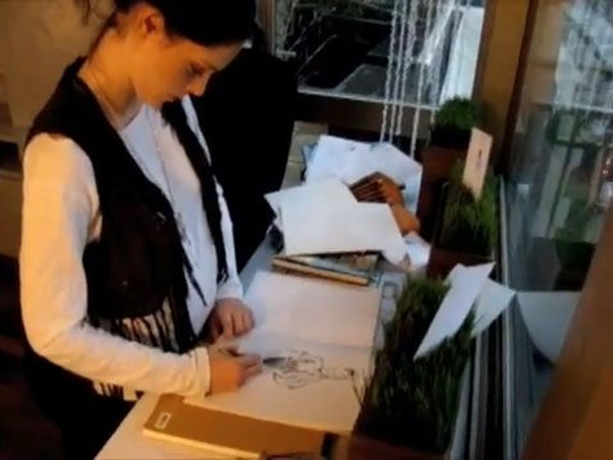 Coco Rocha at work on her sketches