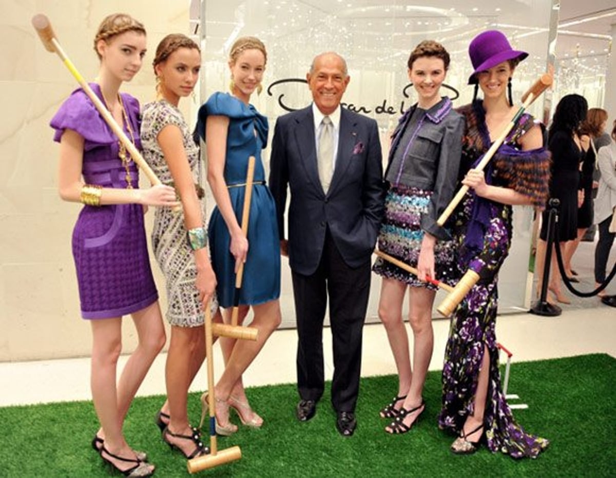 Models pose with designer Oscar de la Renta yesterday at Holt Renfrew in Toronto. Photography by George Pimentel