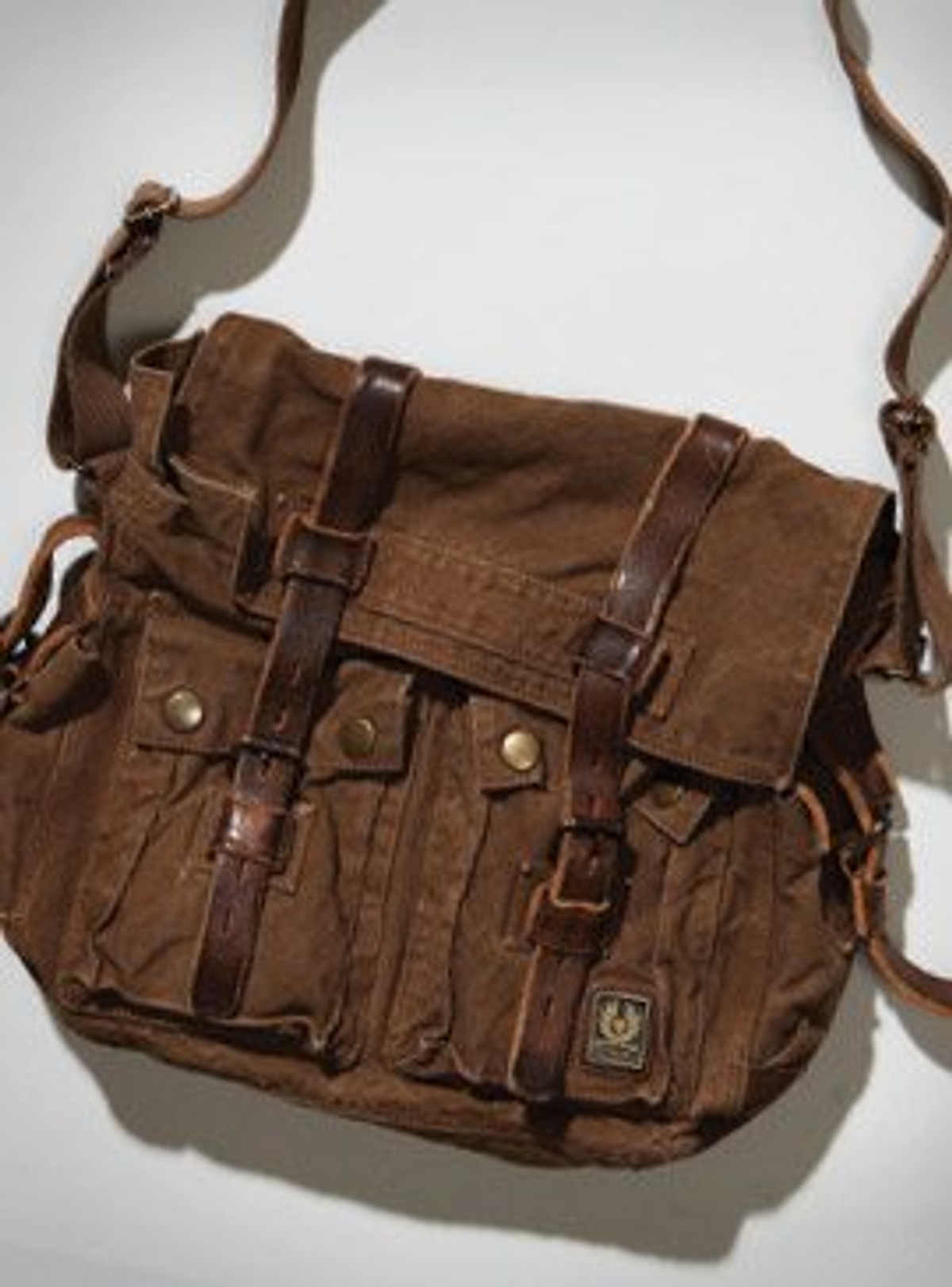Men's style guide: Deliver the goods with this season’s surplus of cross-body bags.