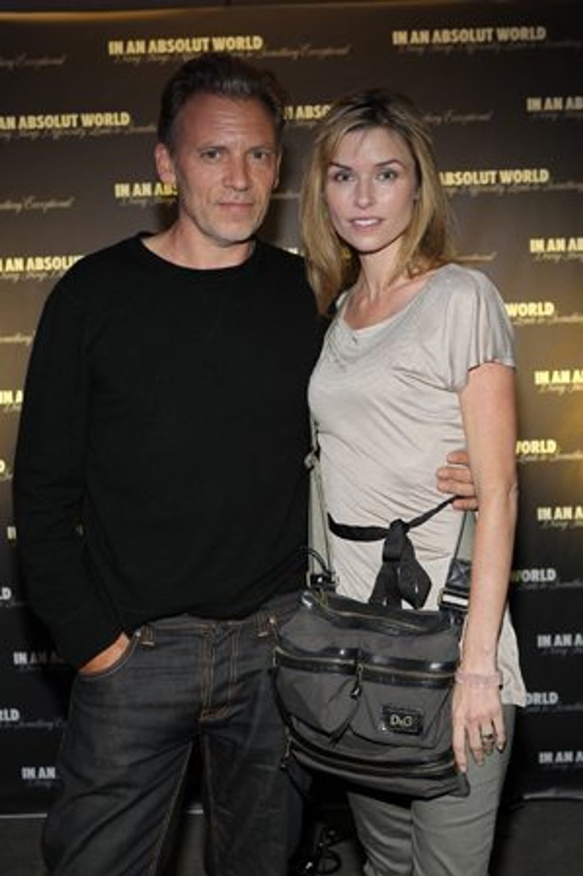 Actors Callum Keith Rennie and Polly Shannon on their way up to the roof at the Absolut party.