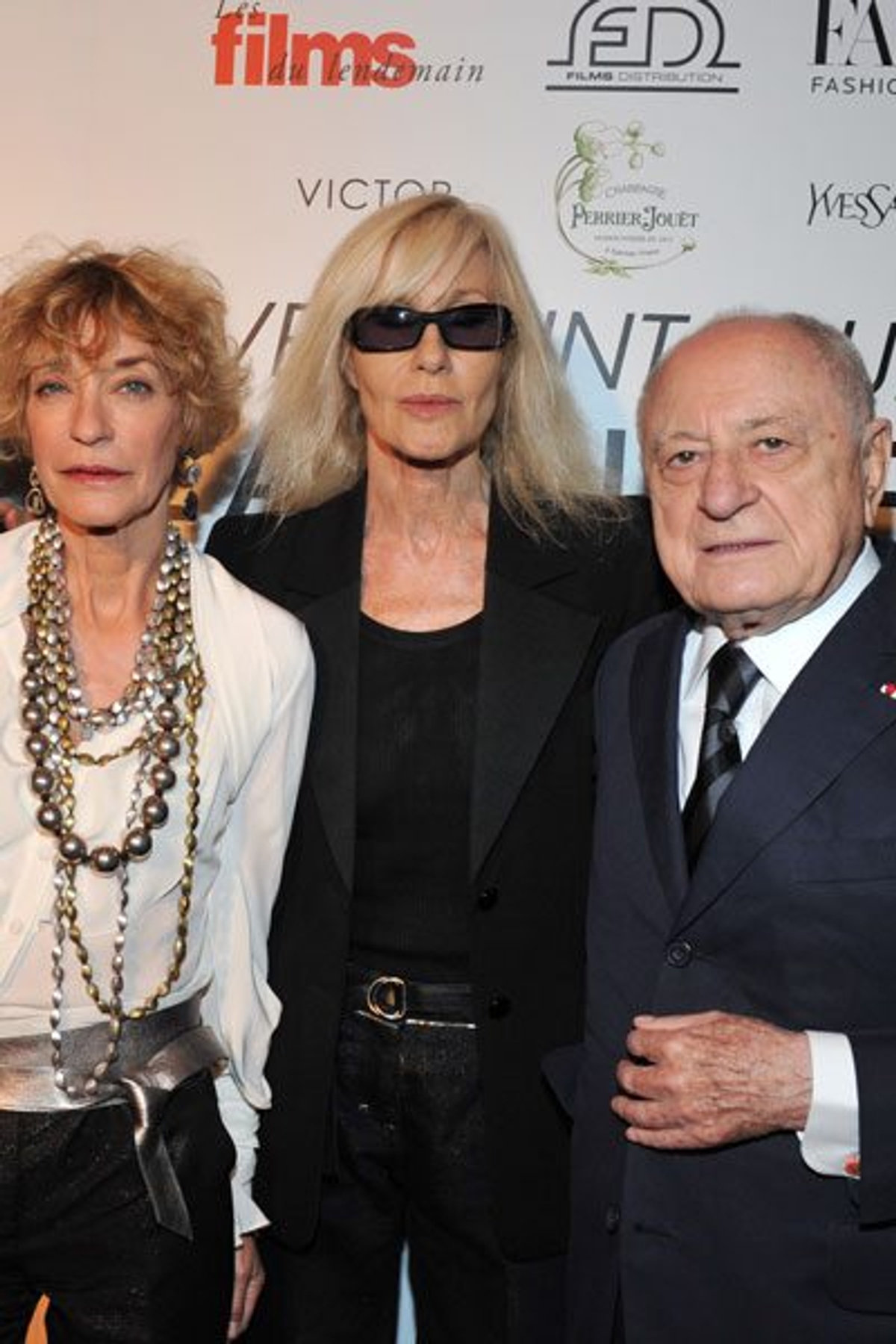 Original Yves Saint Laurent muses Loulou De La Falaise and Betty Catroux with Pierre Bergé. Photography by George Pimentel/WireImage