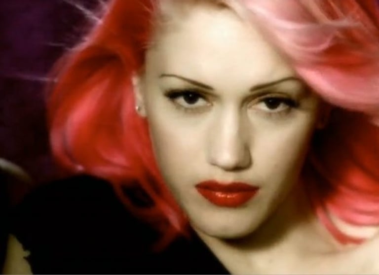 Gwen Stefani pink hair On the eve of No Doubt's comeback, we look back at Gwen and the band's top 10 fashion moments (bindis, braces and all!)
