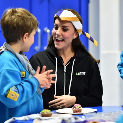 Kate Middleton is back in England and playing with hankies