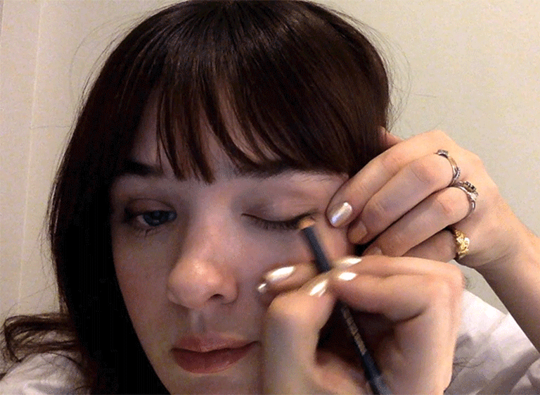 This rhinestone makeup tutorial proves there's nothing more festive than gluing stuff to your face