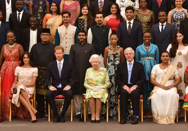 Meghan Markle Wears Prada to Awards Ceremony at Buckingham Palace