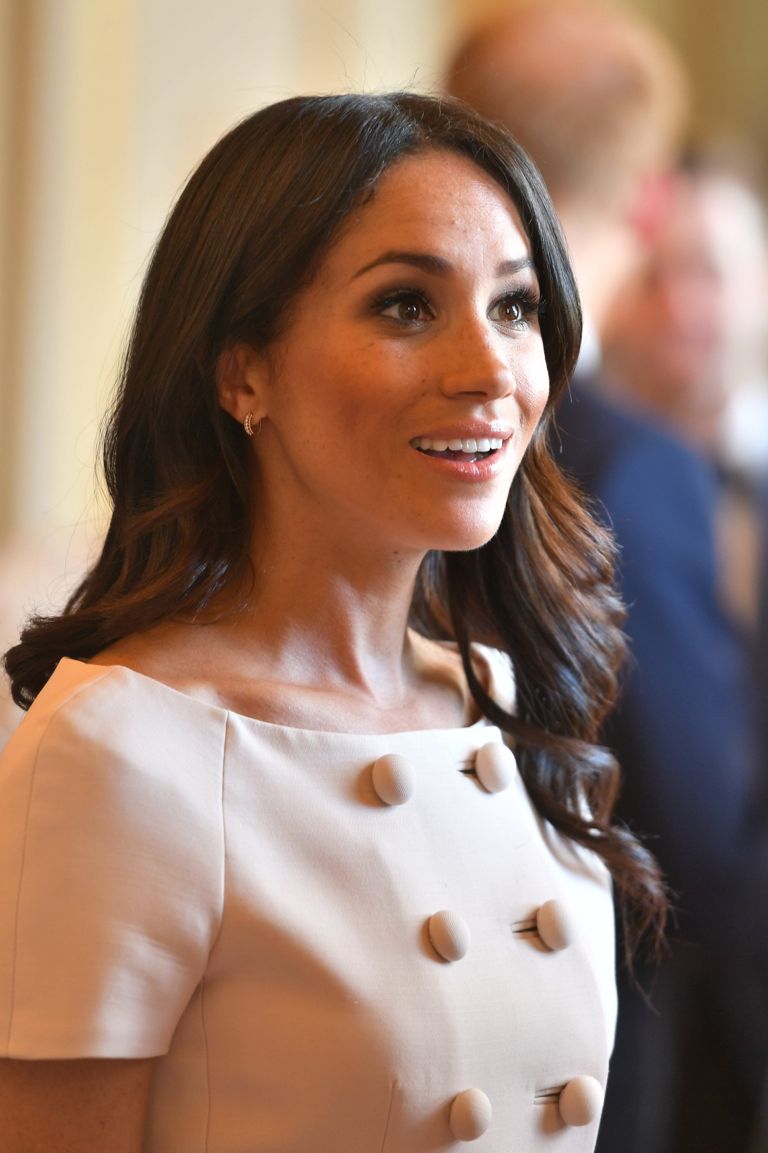 Meghan Markle Wears Prada to Awards Ceremony at Buckingham Palace