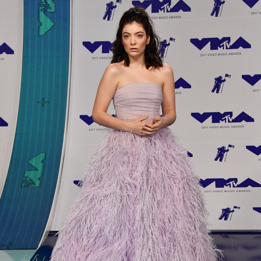 lorde purple dress VMAs best dressed: Lorde stuns in gorgeous feathered gown as stars arrive for their red carpet moment