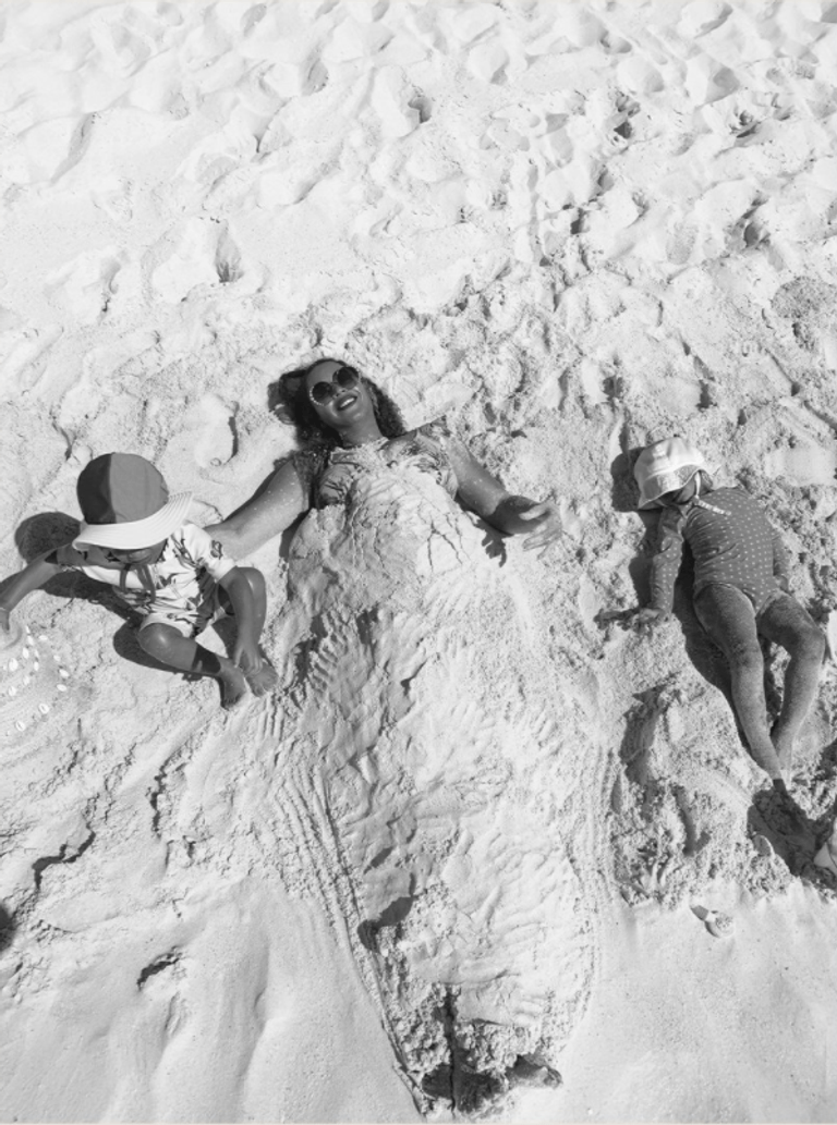 Beyonce and her kids playing in sand