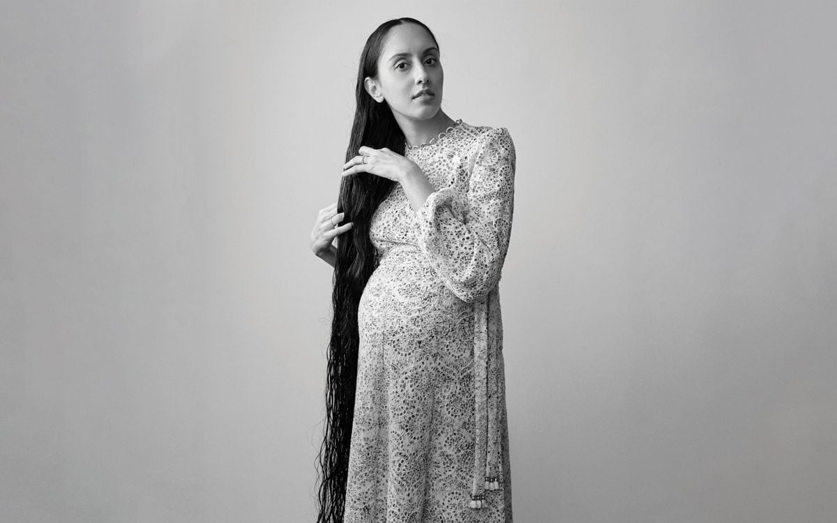 sikh woman with long hair in a dress