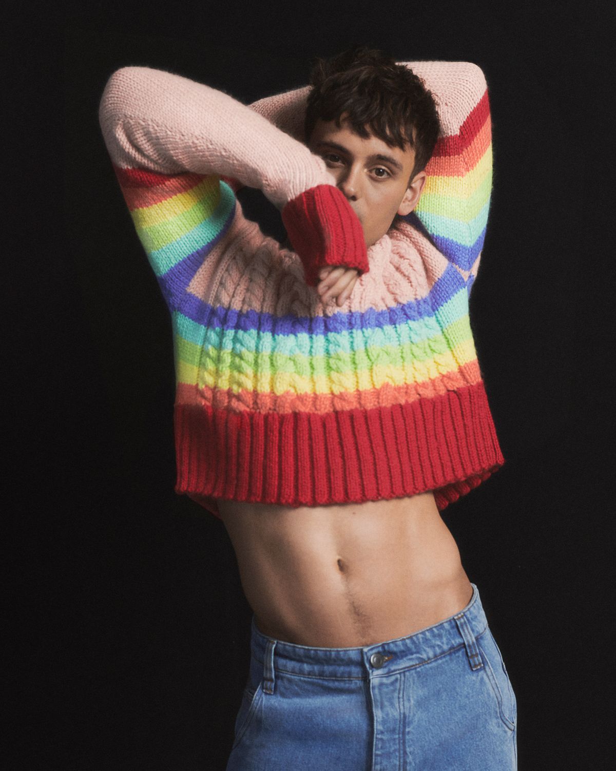 man in a rainbow coloured sweater part of Ami Paris pride collection