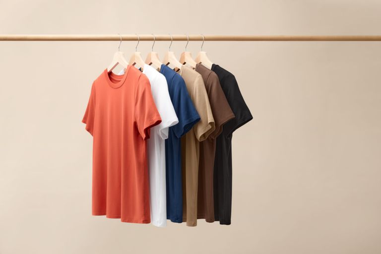 Knix T-shirts hanging in a row