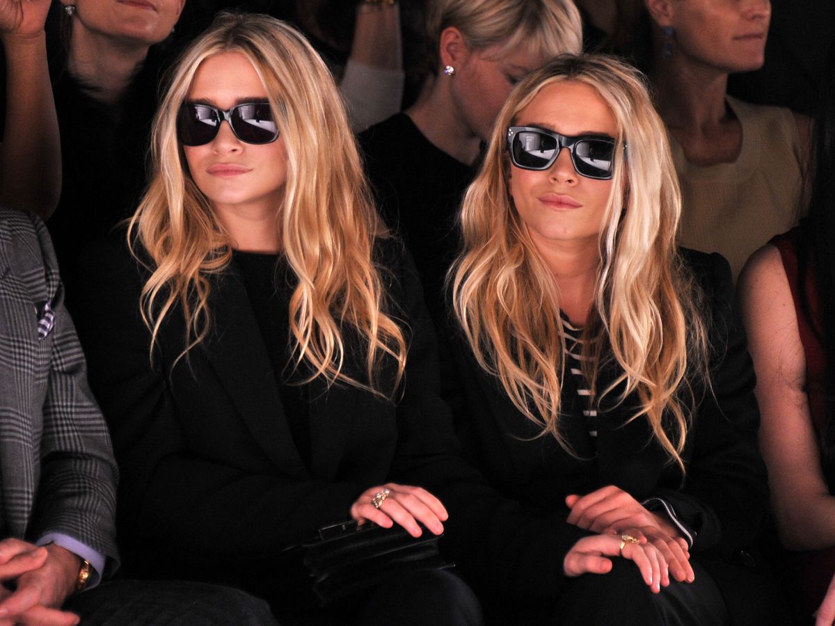 Ashley Olsen and Mary-Kate Olsen attend the J. Mendel Fall 2012 fashion show during Mercedes-Benz Fashion Week at The Theatre at Lincoln Center on February 15, 2012 in New York City wearing quiet luxury brands
