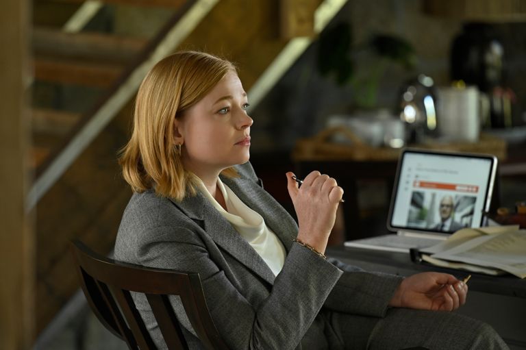 Shiv sitting at a desk in 'Succession.'