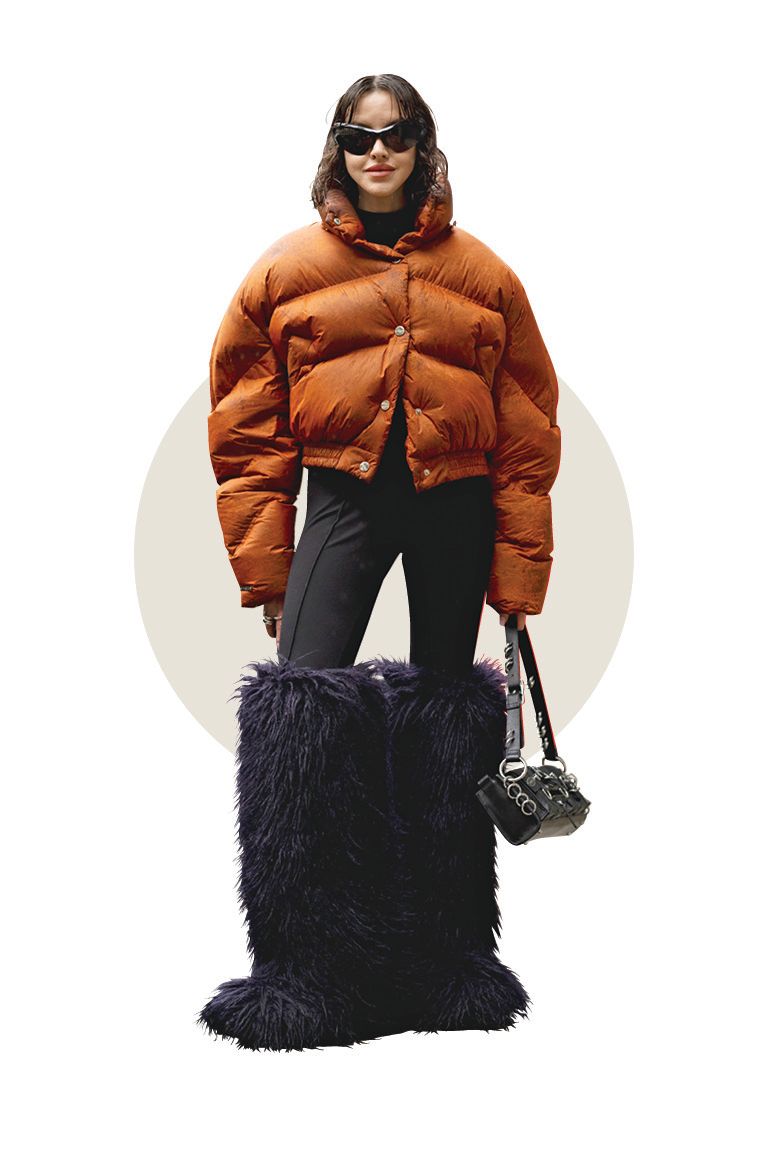 Woman wearing brown puffer bomber coat, latte dressing