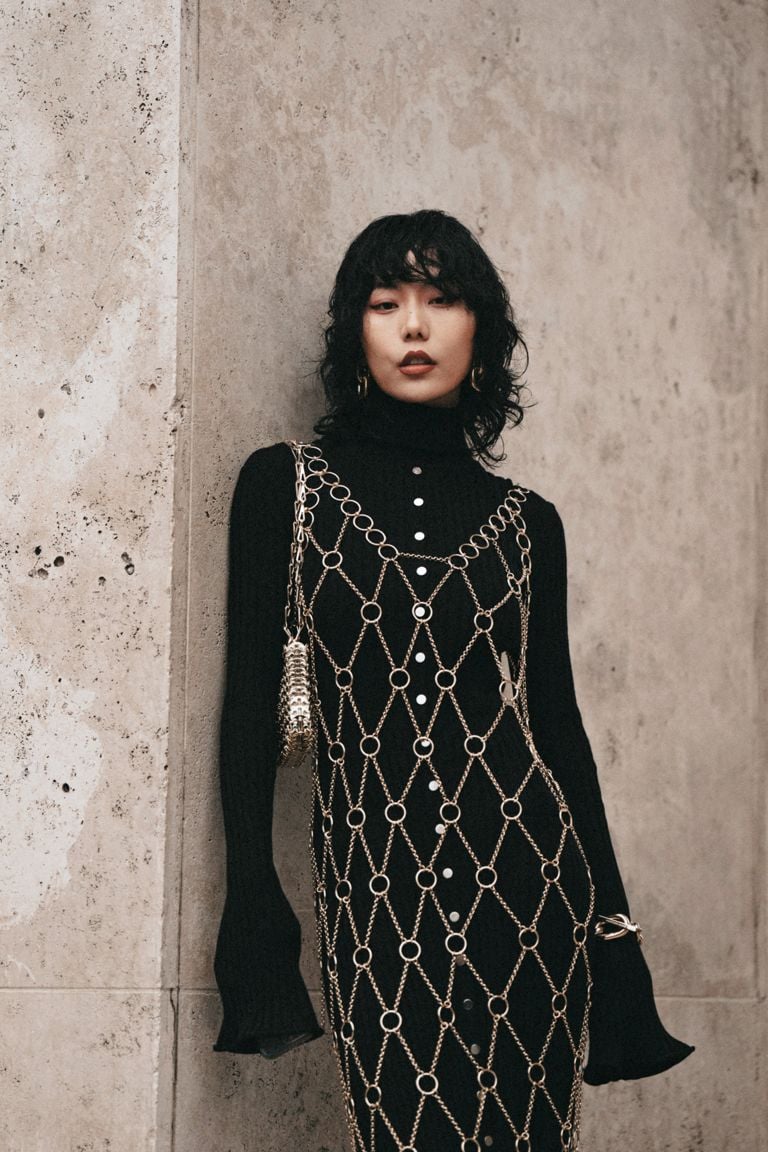 woman in a beaded mesh dress