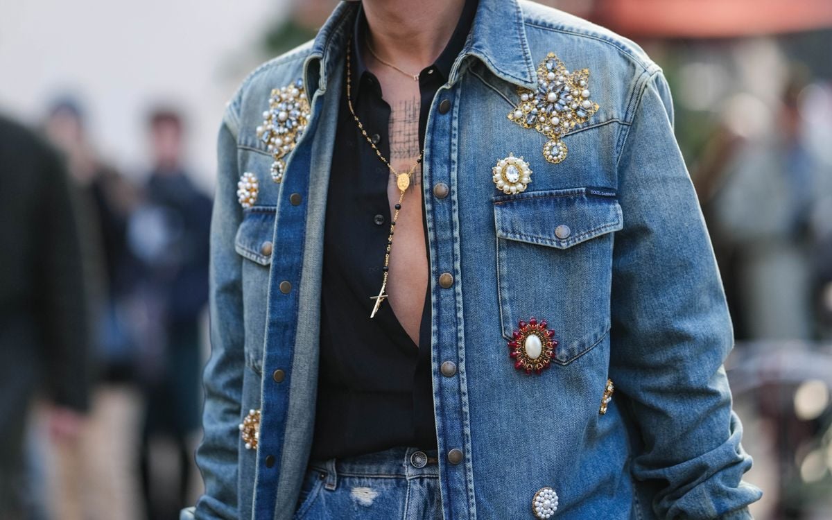 brooches, several unique brooches embellish a denim jacket