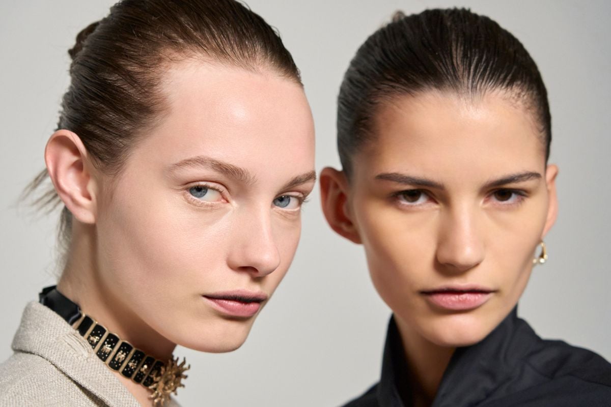 slick back ponytail: Two models with slicked back hair
