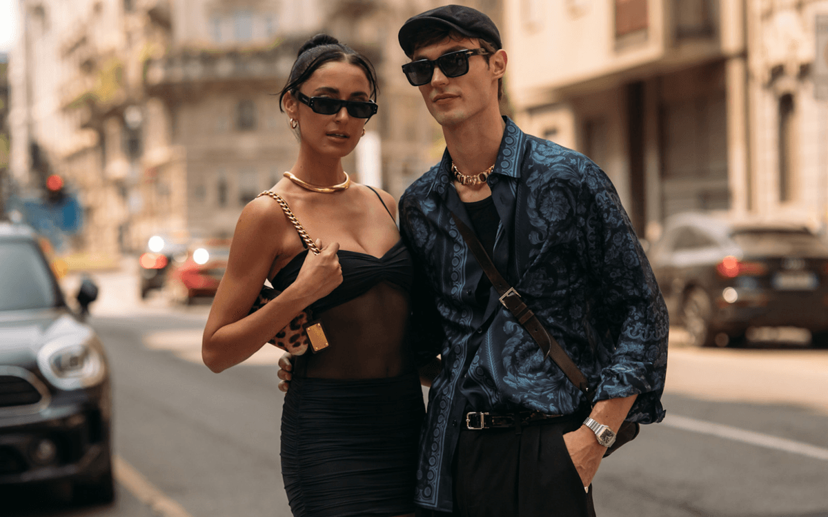 Best sunglasses, affordable sunglasses: Two people pose while wearing dark sunglasses