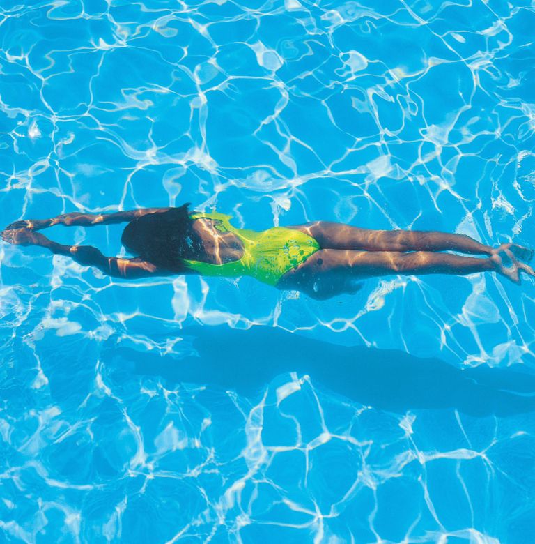 A woman swims in a pool
