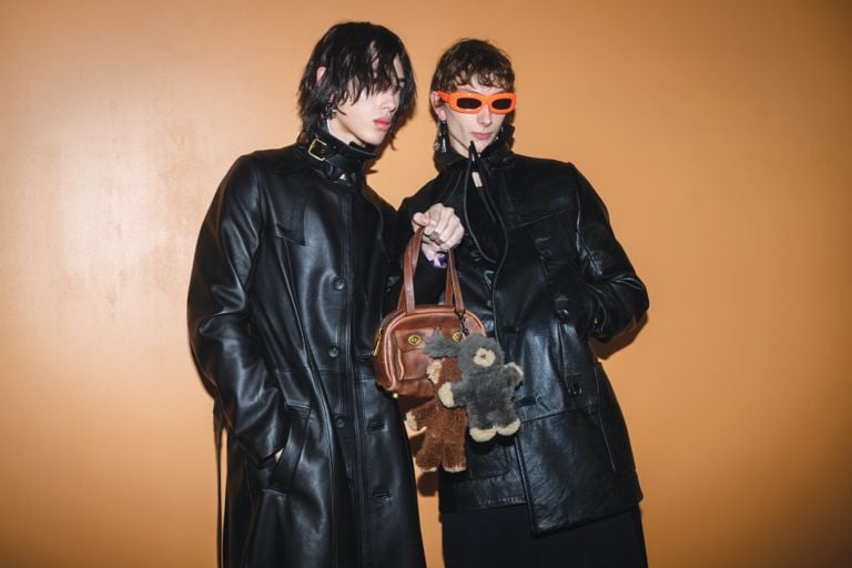 Coach shoulder bag: Models pose with the Coach Twin Pocket bag backstage