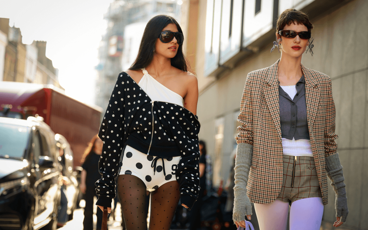 London Fashion Week street style: two people walking side by side on the streets of London during fashion week