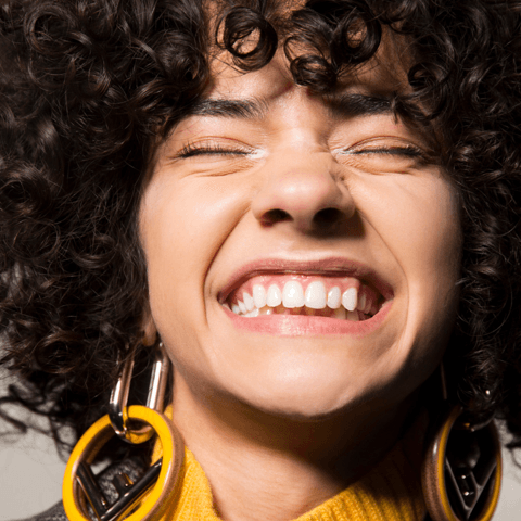 Everything You Need To Know About Styling Curly Bangs