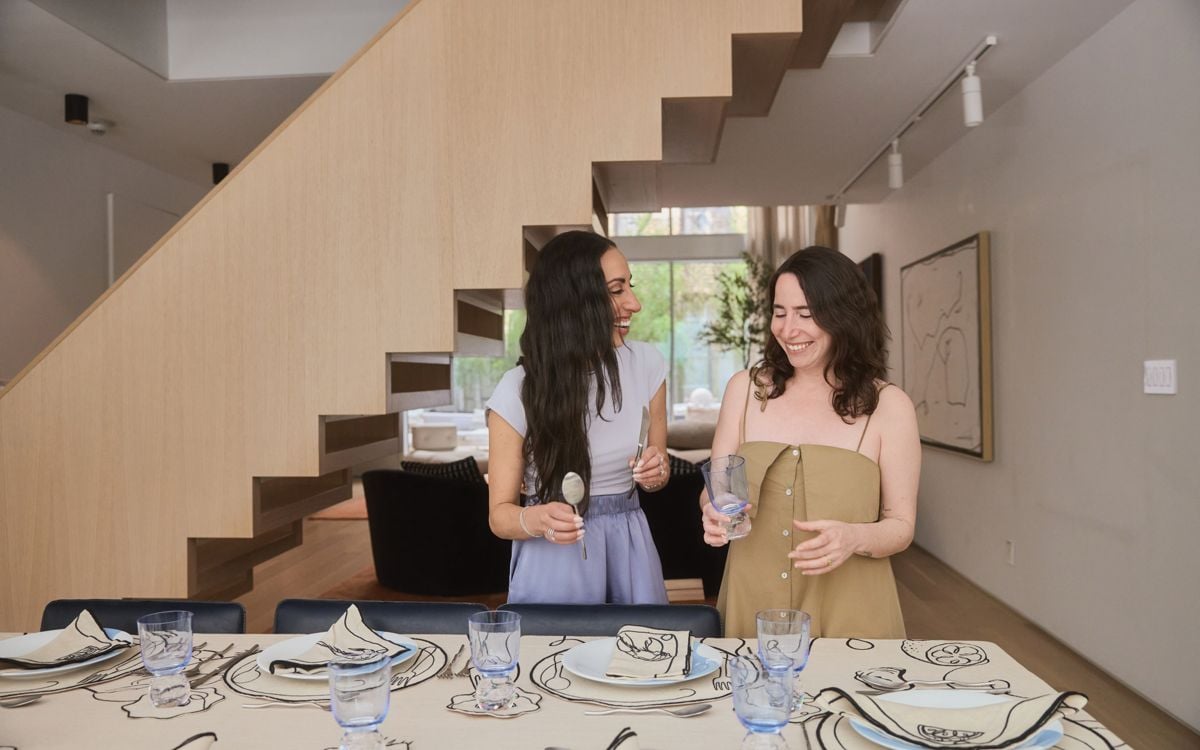Amy Burstyn Fritz and Sarah Pecaut of Misette set a table
