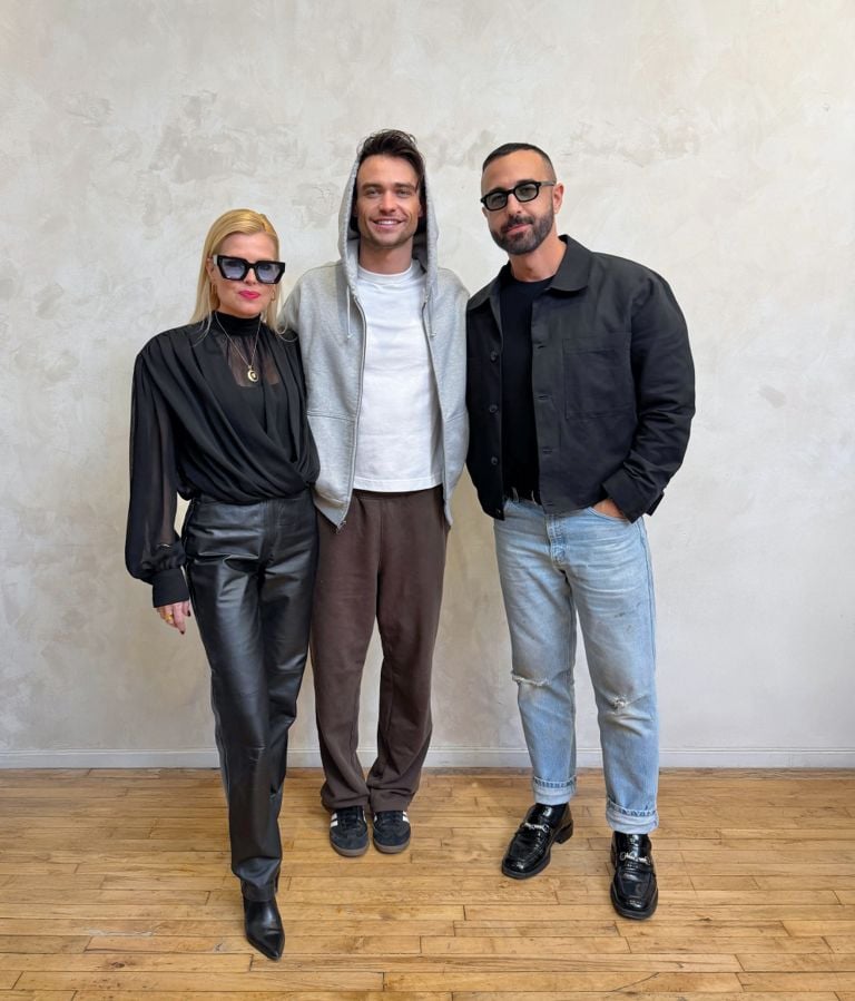 Thomas Doherty, FASHION's Publisher Deidre Marinelli and FASHION's Senior Creative Director for FASHION and Events George Antonopoulos pose for a photo