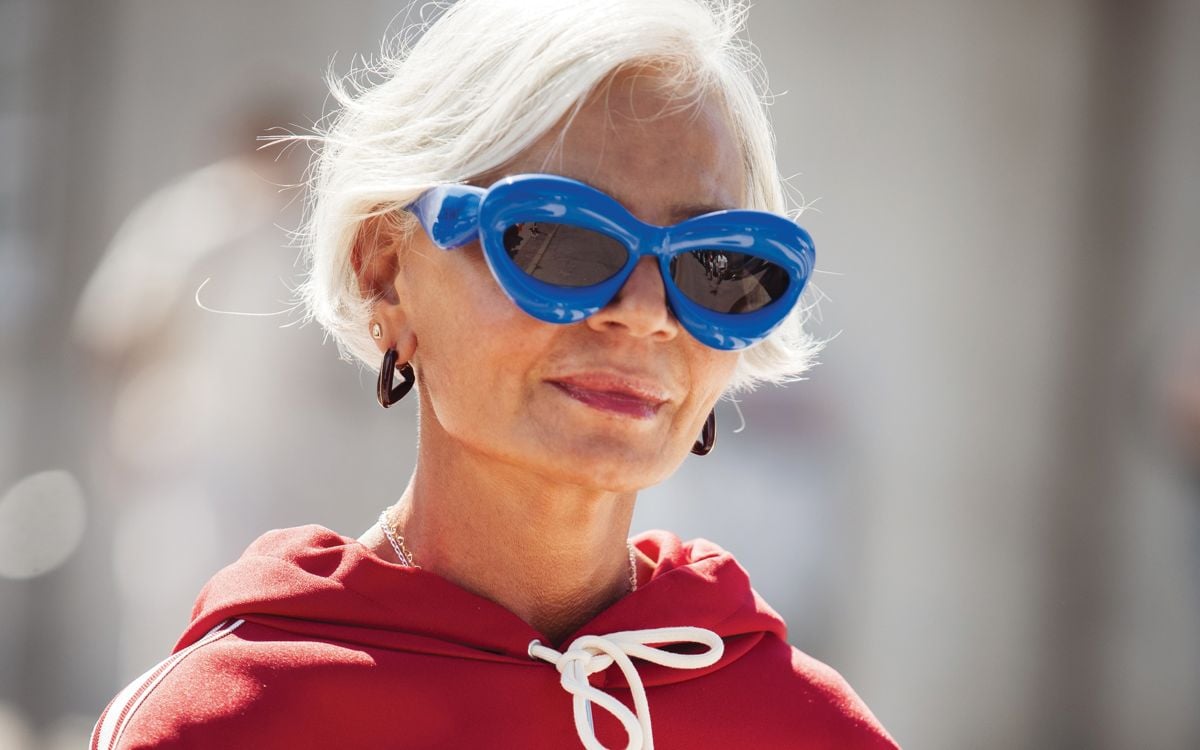 Spring Sunglasses. COPENHAGEN, DENMARK - AUGUST 06: Grece Ghanem wears navy blue jeans, red Celine sweater, and blue Loewe sunglasses outside the Lovechild 1979 show during day two of the Copenhagen Fashion Week (CPHFW) SS25 on August 06, 2024 in Copenhagen, Denmark.