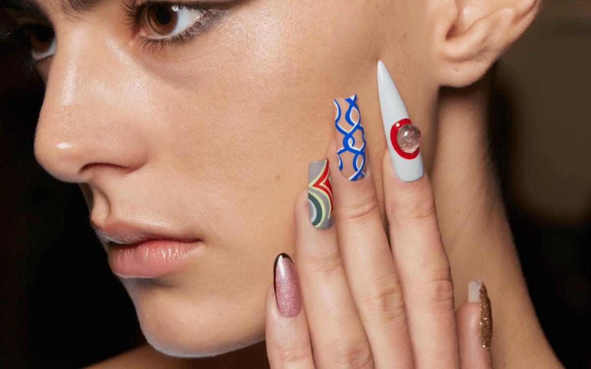 spring nail art trends: A model wearing a manicure with spring nail colours