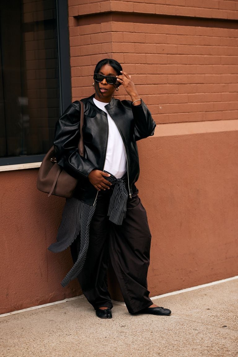 A person wears a leather jacket. best spring jackets