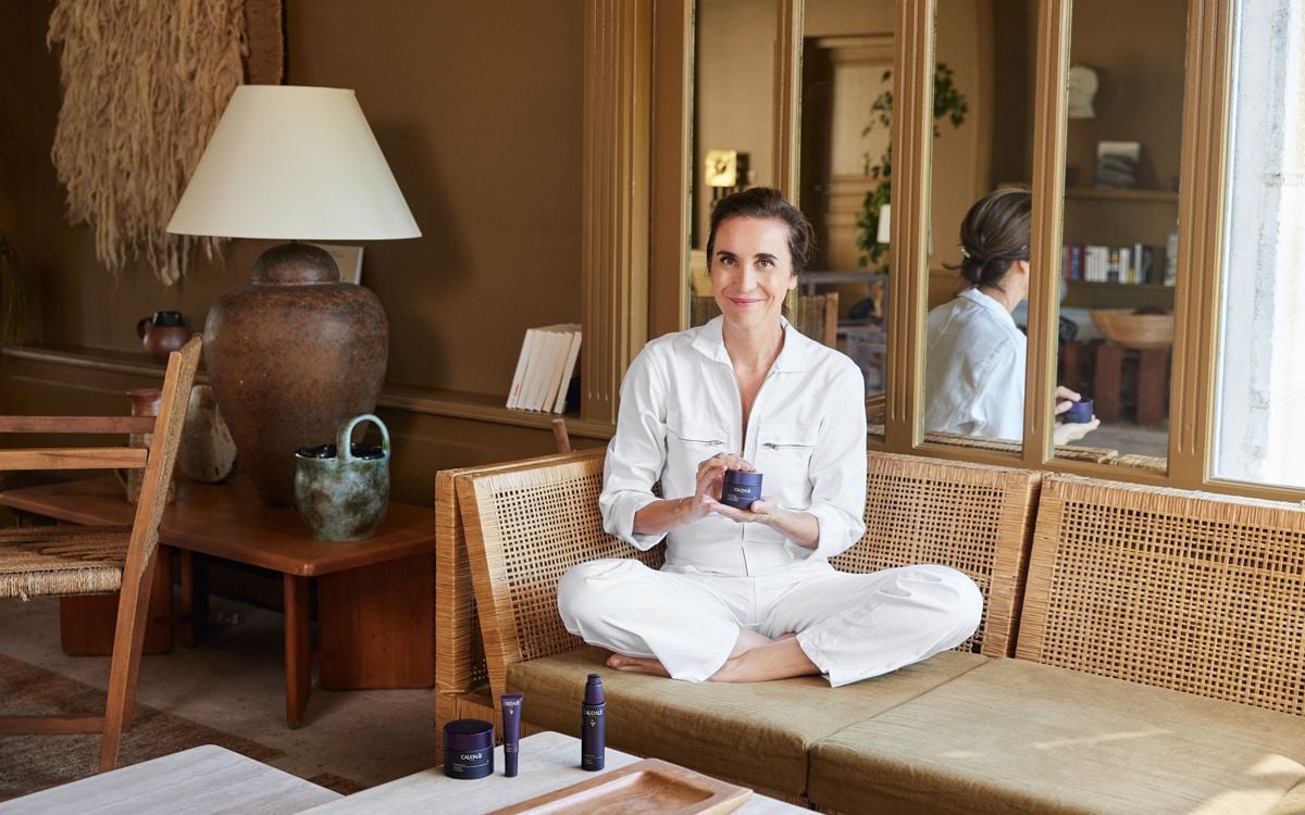 Mathilde Thomas holding Caudalie product