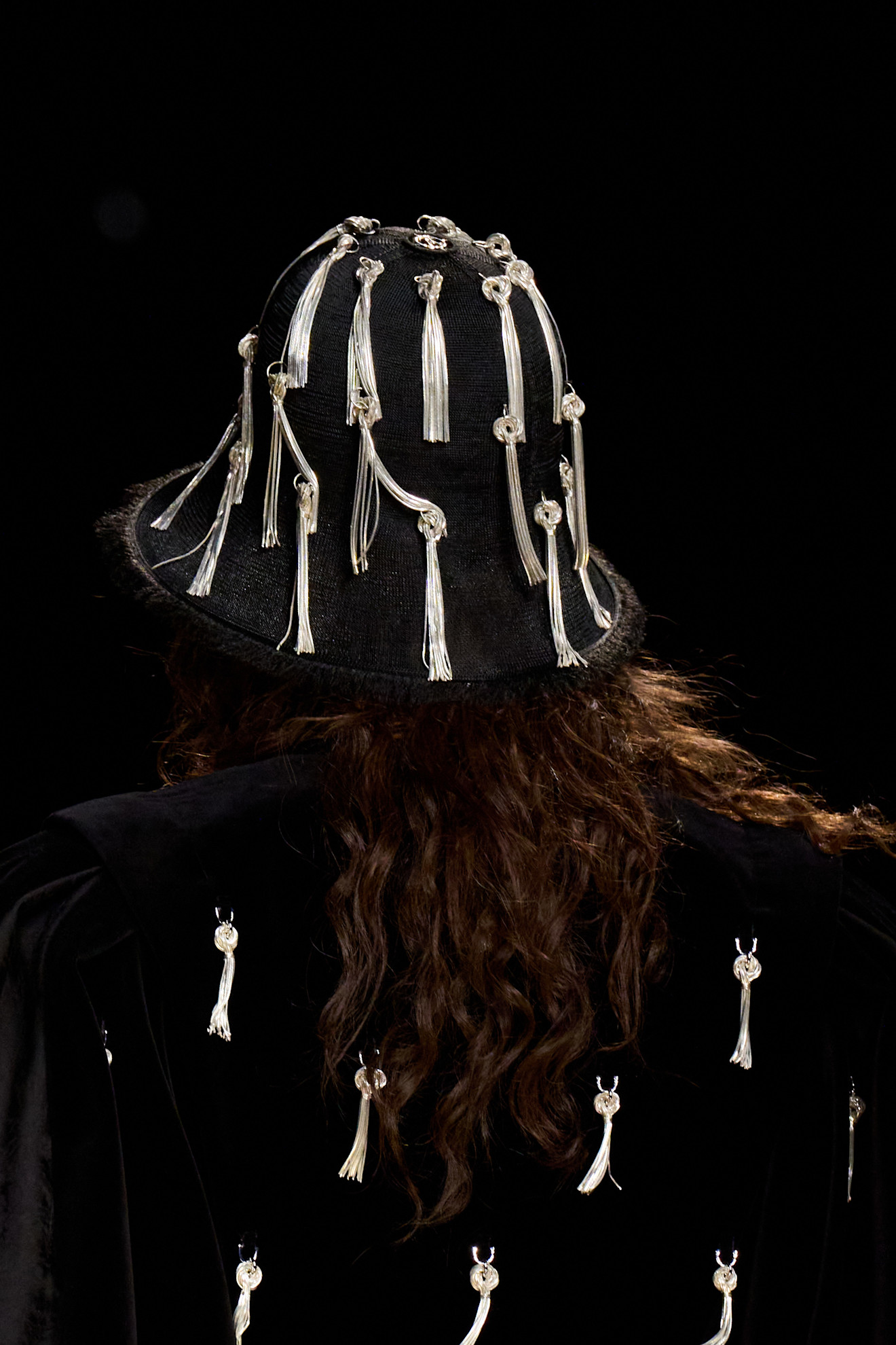 Fashion hats, pillbox hats: A model wears a tasselled hat on the Louis Vuitton runway
