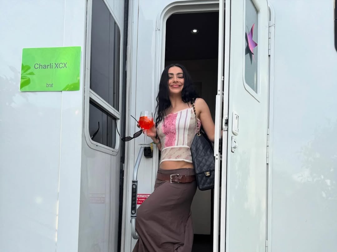 charli xcx sipping her signature drink, an aperol spritz