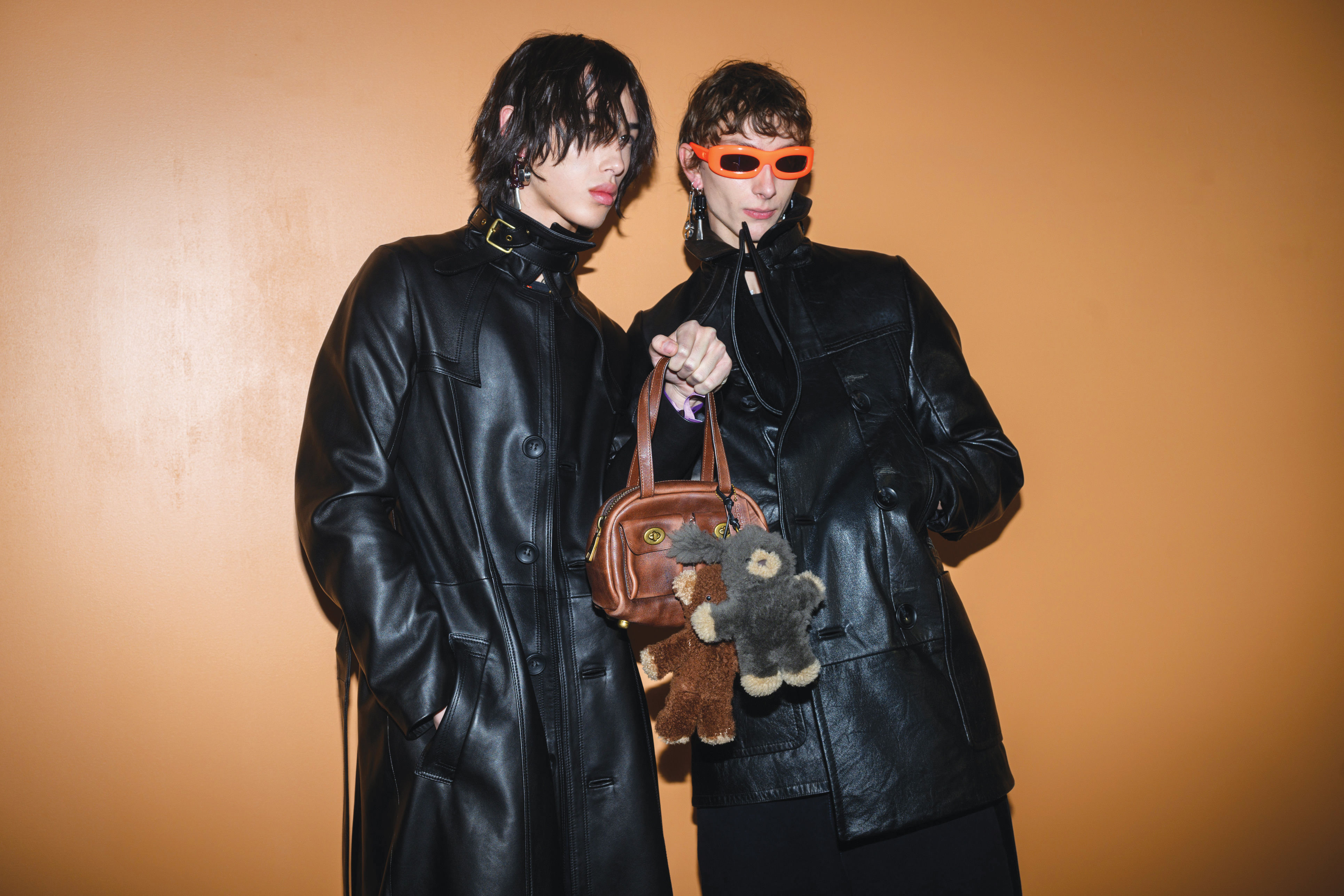 Coach shoulder bag: Models pose with the Coach Twin Pocket bag backstage