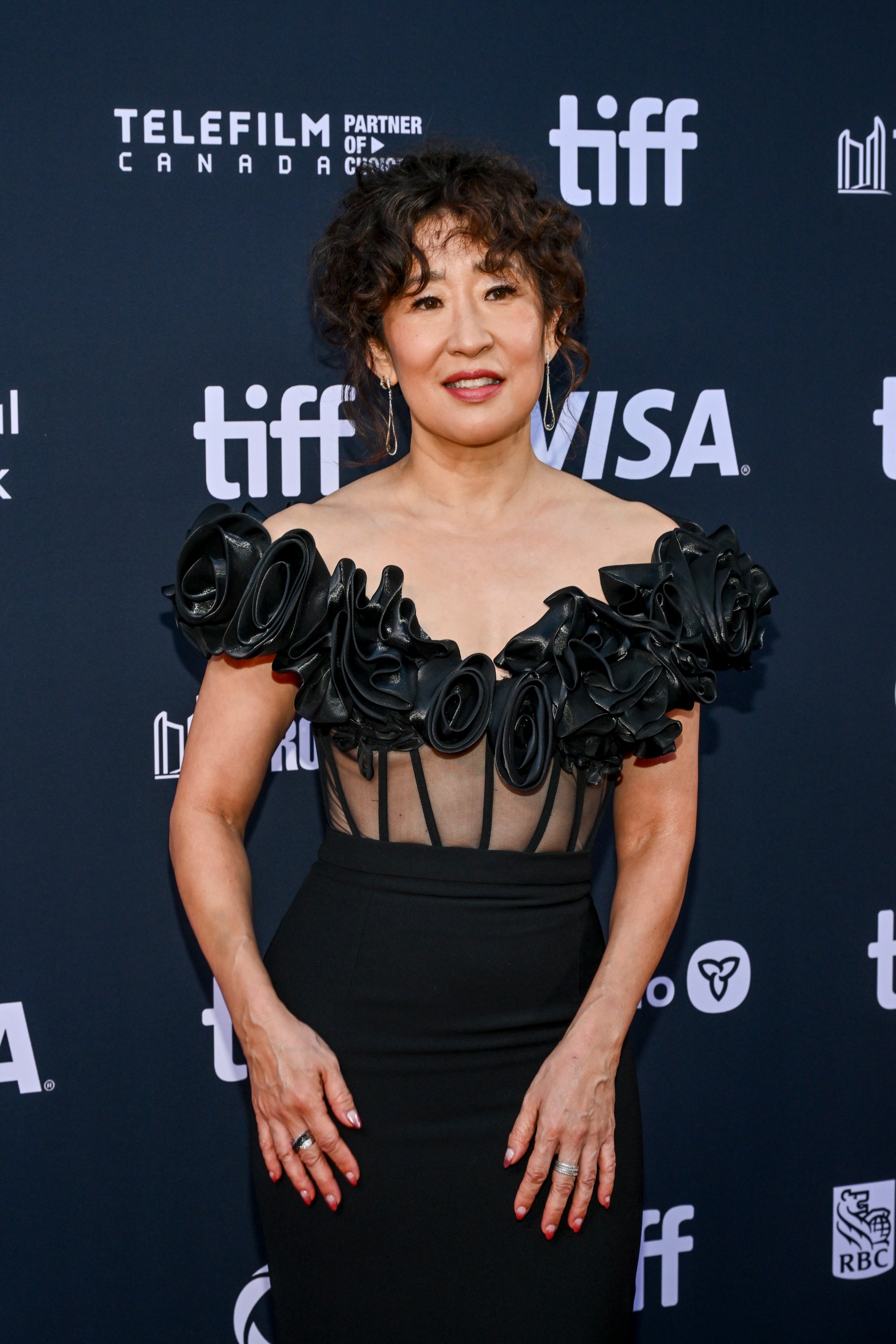 Sandra Oh with curly bangs
